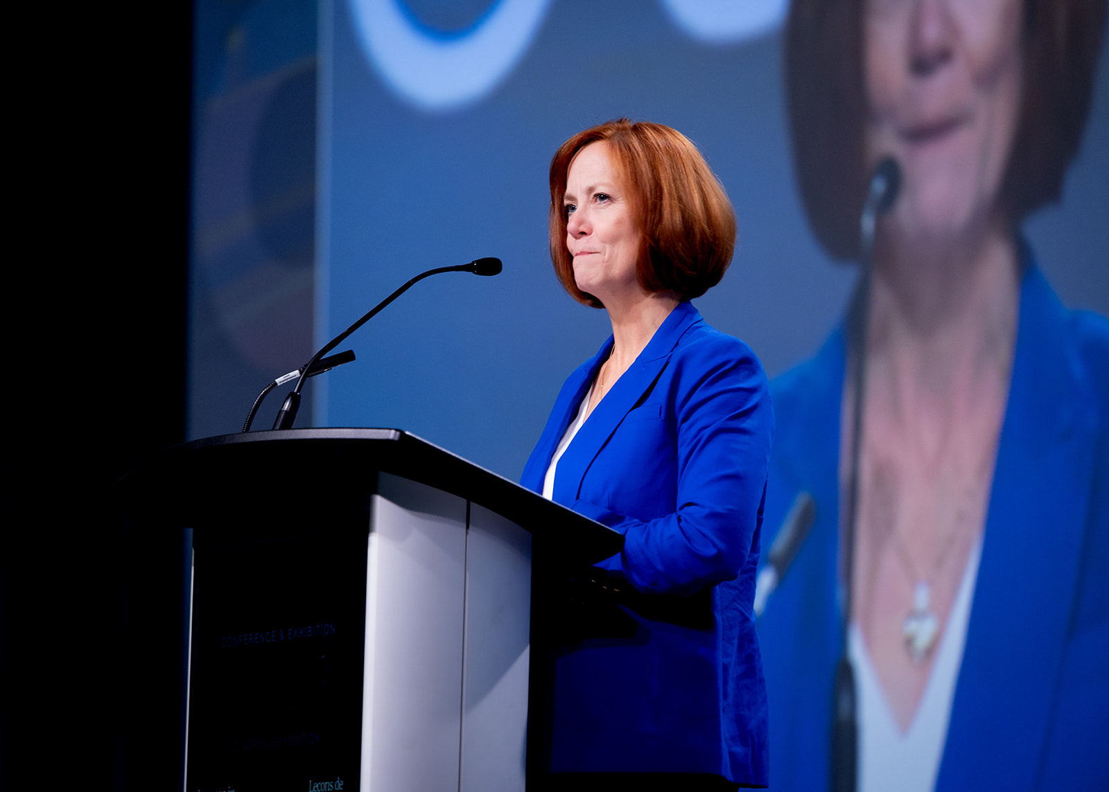 Sarah Wells at a podium